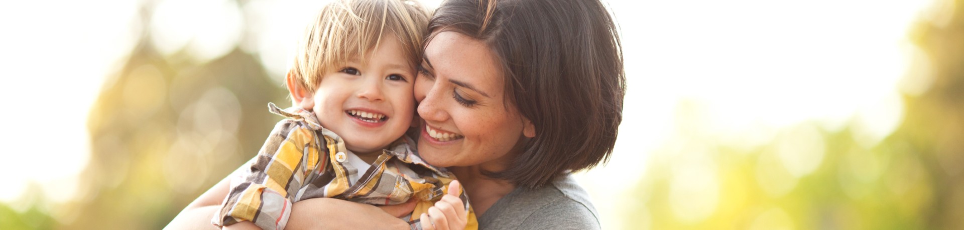 Mother Holding Smiling Child