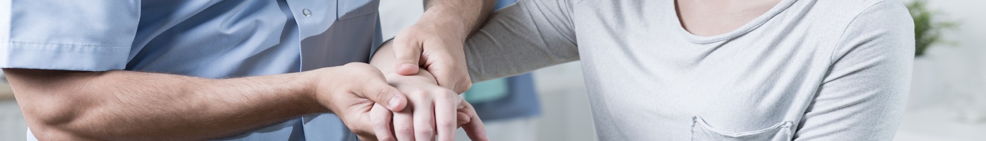 Woman getting wrist examined