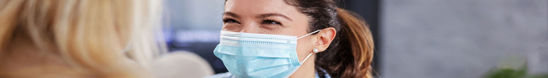 Healthcare provider smiling in mask