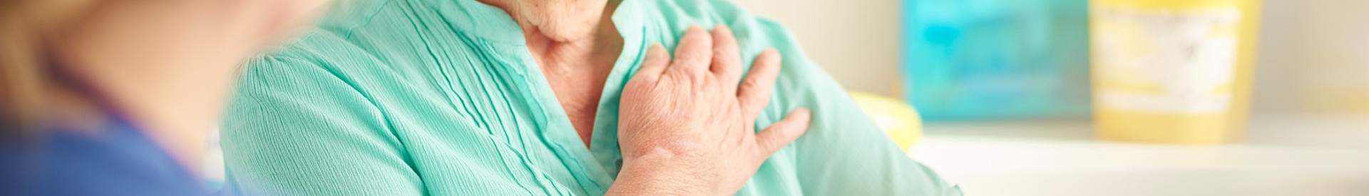 Older woman holding her chest